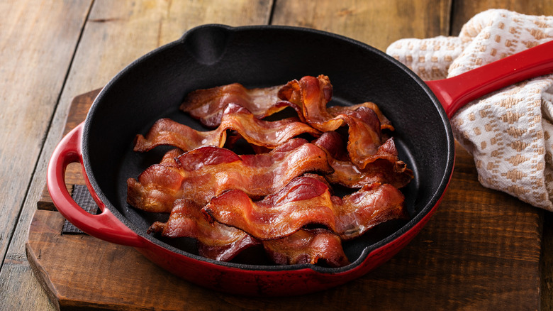 slices of bacon in skillet