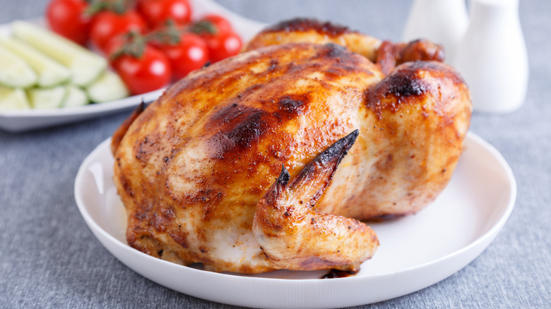 whole rotisserie chicken on plate