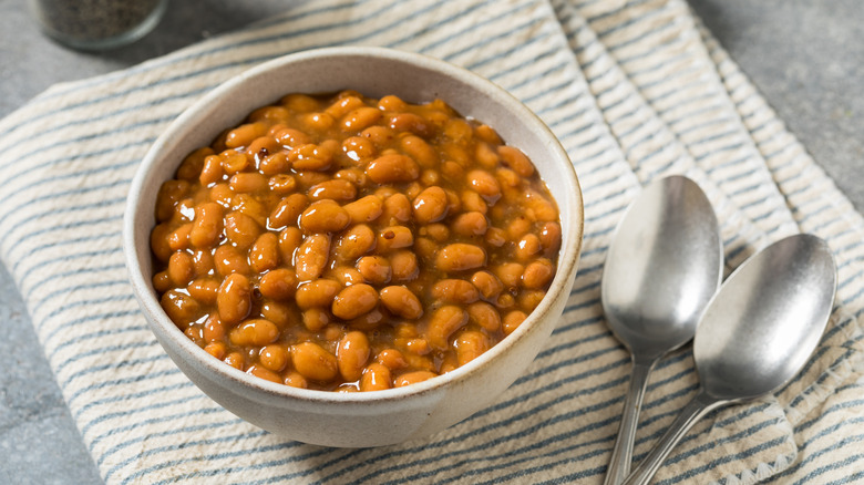 bowl of baked beans with spoon