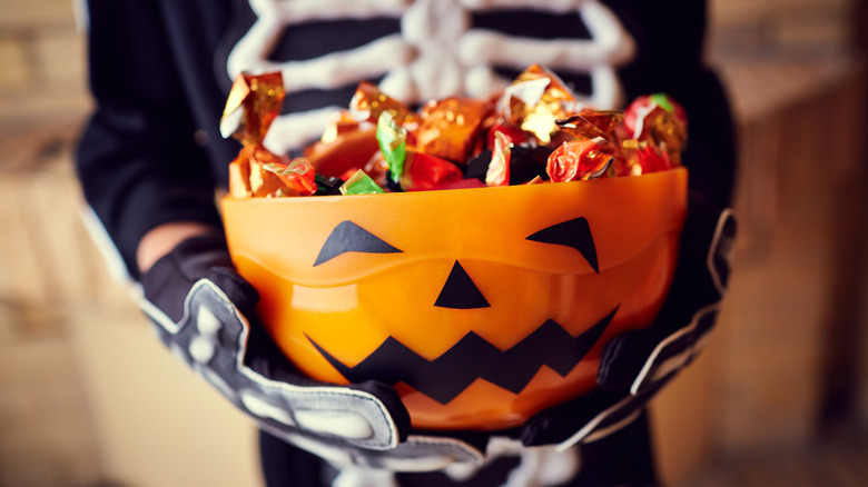 jack-o-lantern filled with halloween candy
