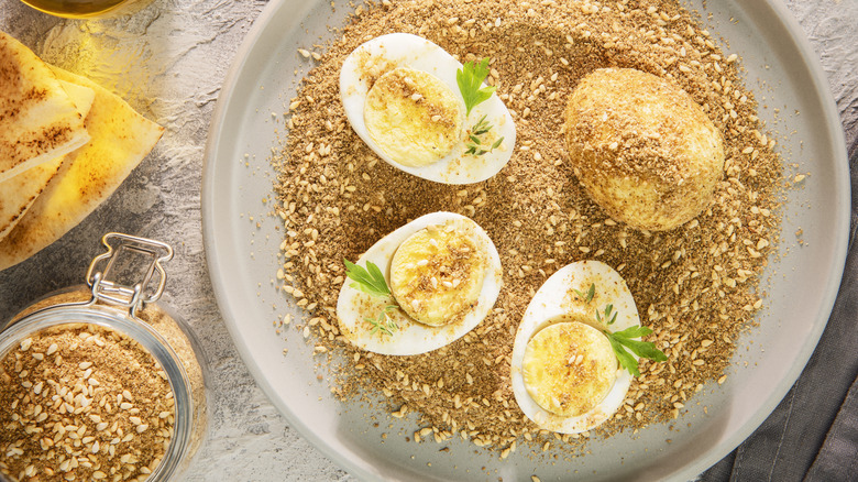 Hard-boiled eggs in a dish of dukkah