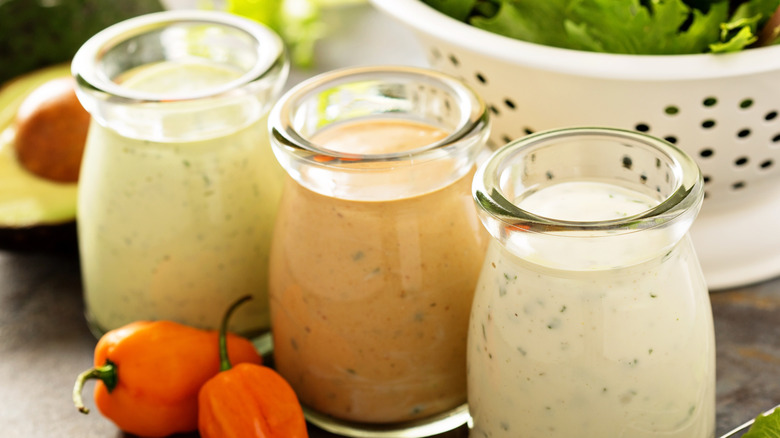 Three jars of creamy dressing