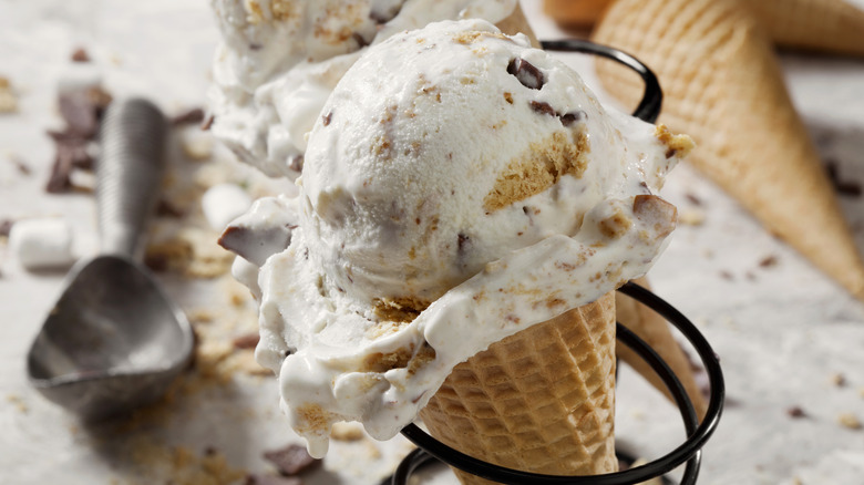 Cone of vanilla rocky road ice cream
