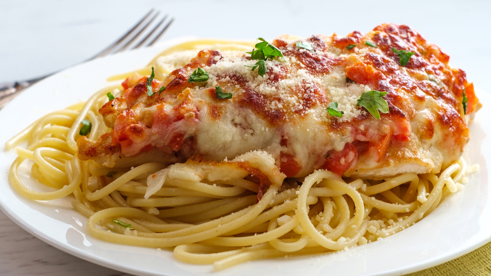 One Flavorful Swap Gives Traditional Chicken Parm A Southern-Style Twist