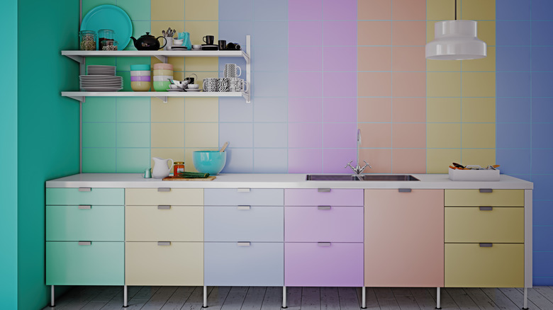 Colorful retro pastel kitchen cabinets with matching tiles