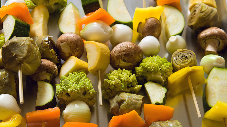 Pearl onions, zucchini, and peppers on skewers