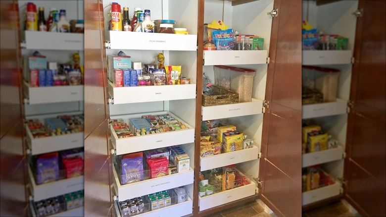 A well-organized kitchen cabinet with pull-out drawers