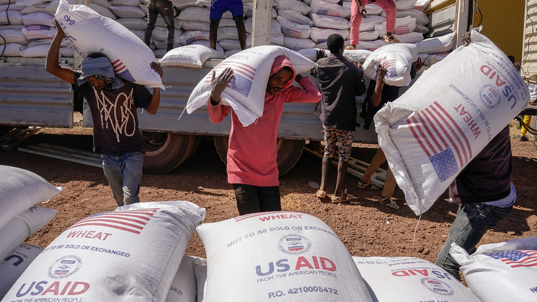 People carry USAID bags in Africa