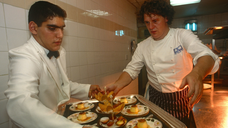 Marco Pierre White working in kitchen
