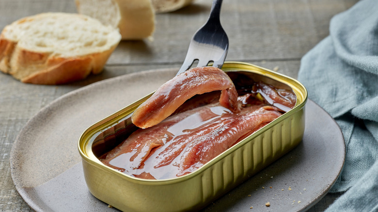 fork picking up anchovies