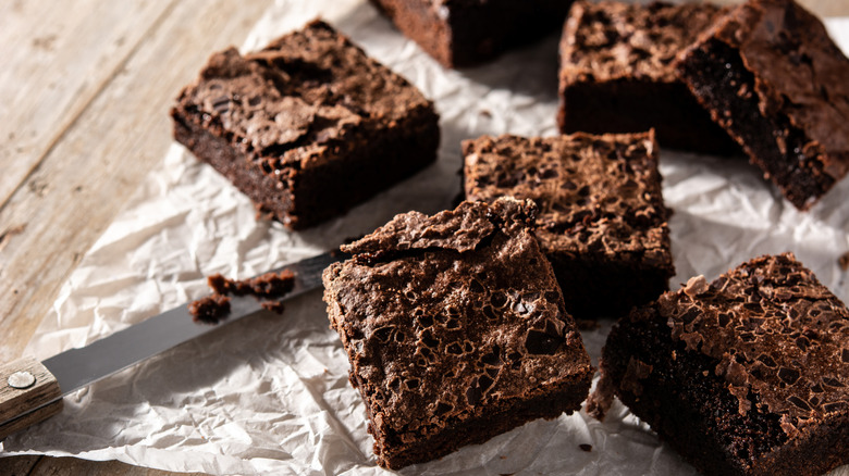 pieces of homemade brownie on parchment paper