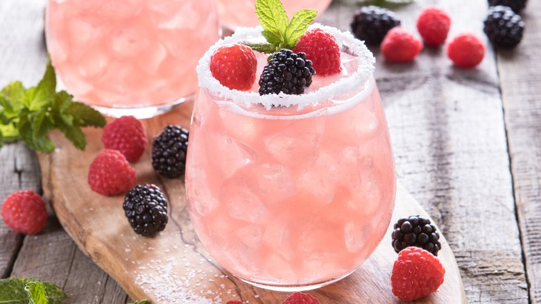 Pink cocktail with frozen berries