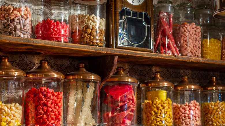 Retro candies in glass jars in an old-timey candy store