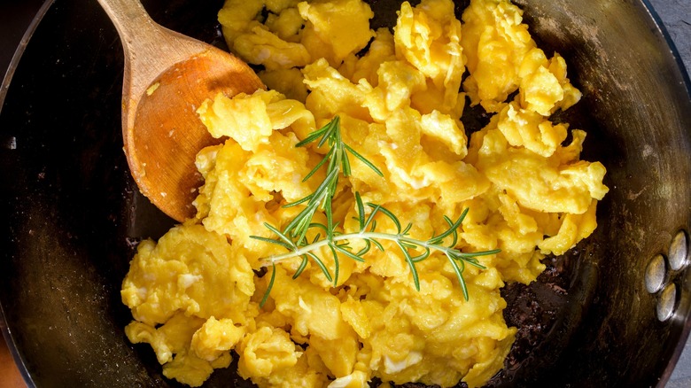 Fluffy scrambled eggs with rosemary