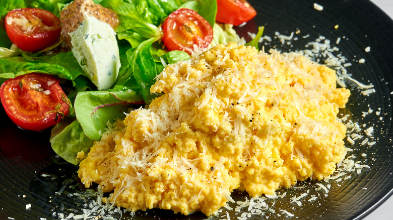 ricotta scrambled eggs with parmesan and salad