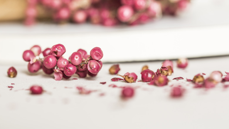Sliced pink peppercorn white board