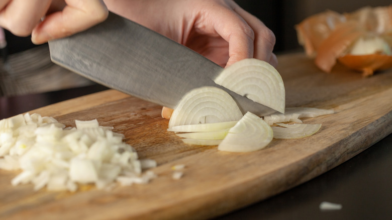 dicing onions on cutting board