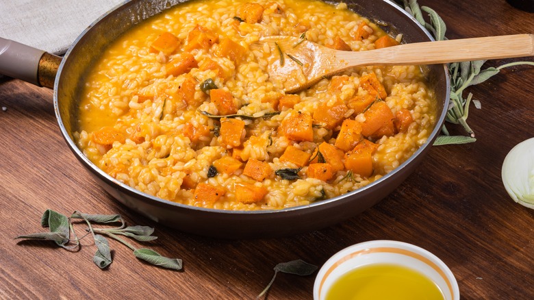pumpkin risotto and container of broth