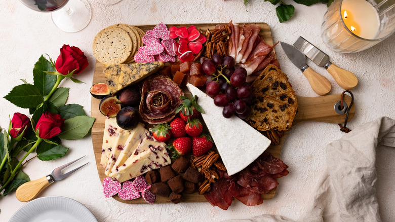 charcuterie board with roses 