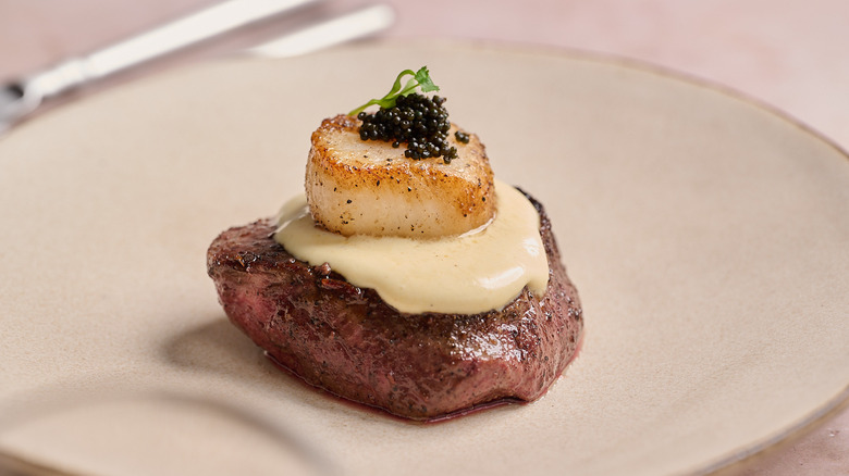 surf and turf on a plate with sauce