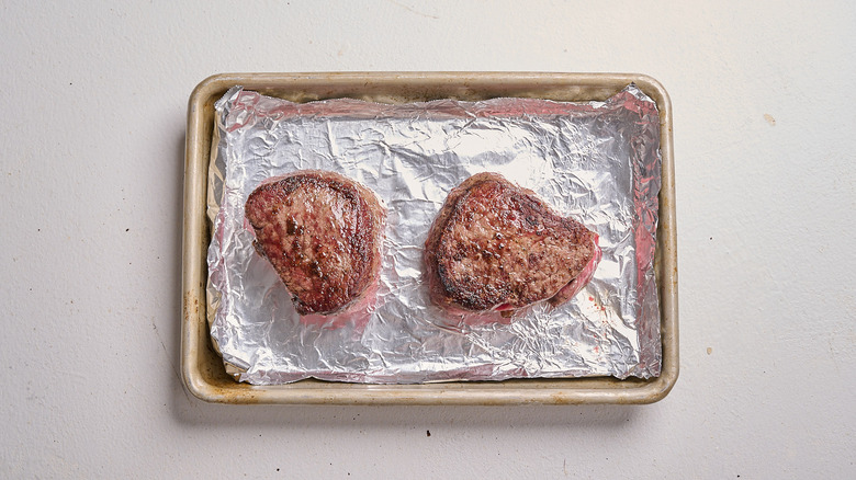 steaks on a sheet pan
