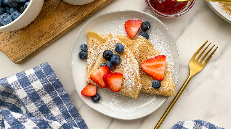 crepes on plate with fruit