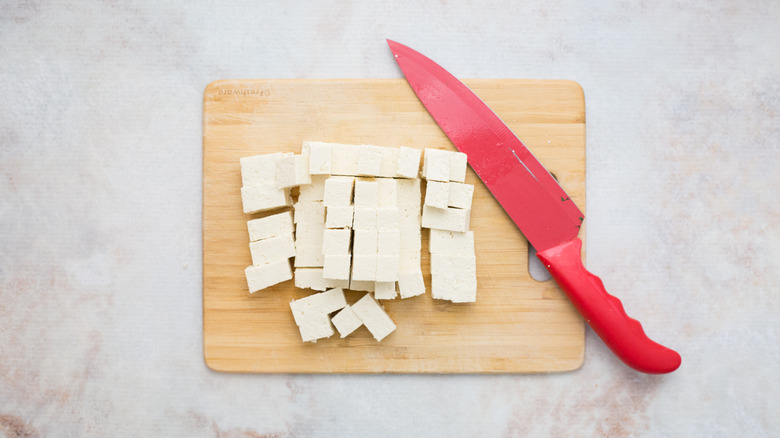 cubed tofu on cutting board