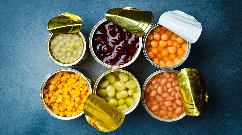 aerial photo of opened cans of beans and vegetables