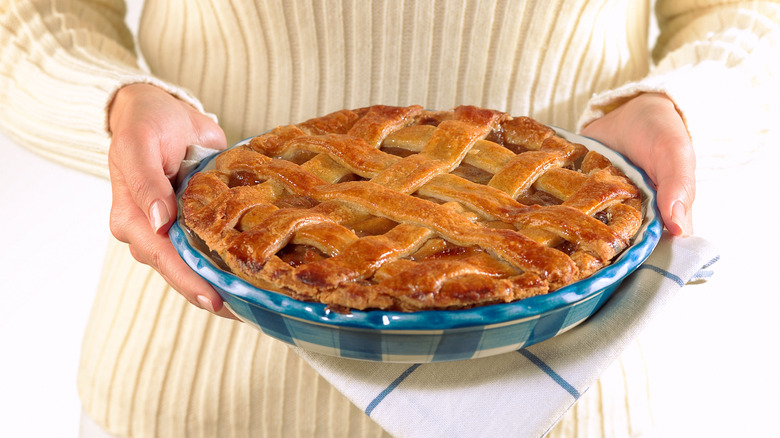 fresh lattice-topped apple pie in dish