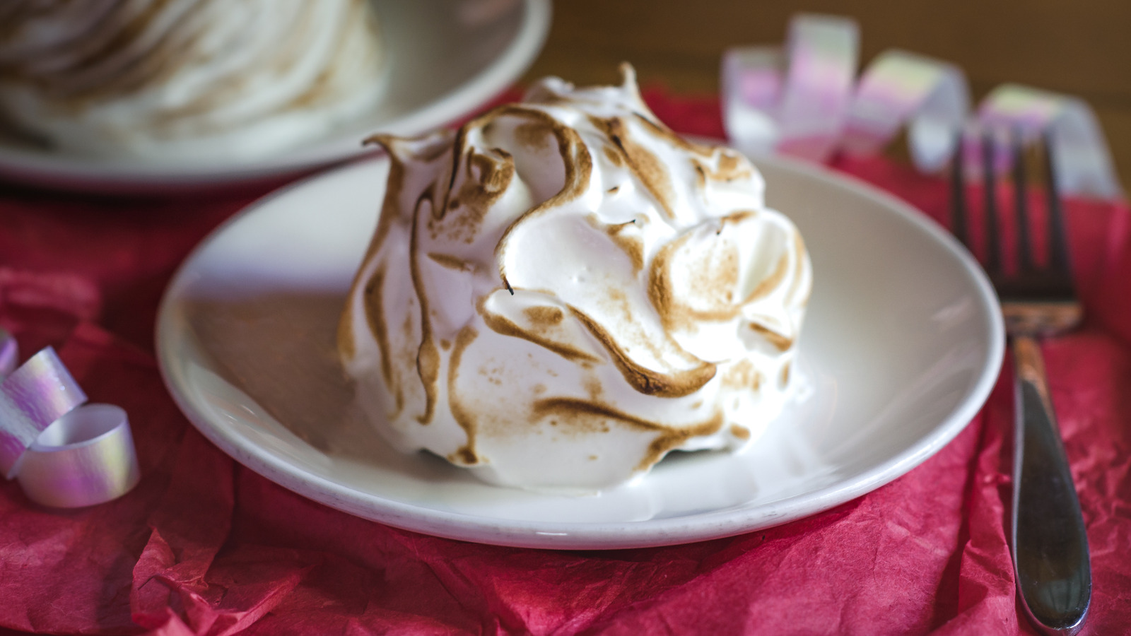 Vinegar Is The Key To Perfectly Spiked Meringue Peaks On Baked Alaska