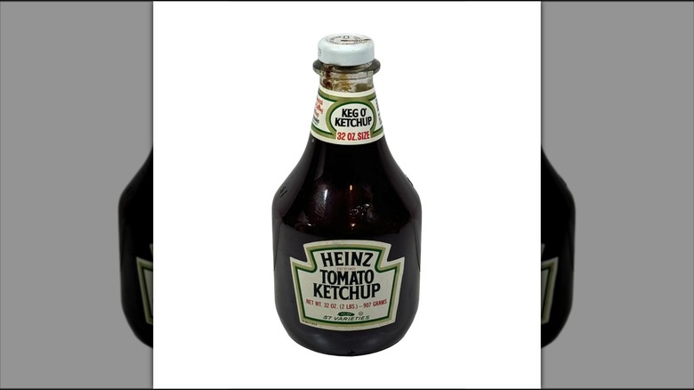 old bottle of Heinz Ketchup against white background, mirrored image