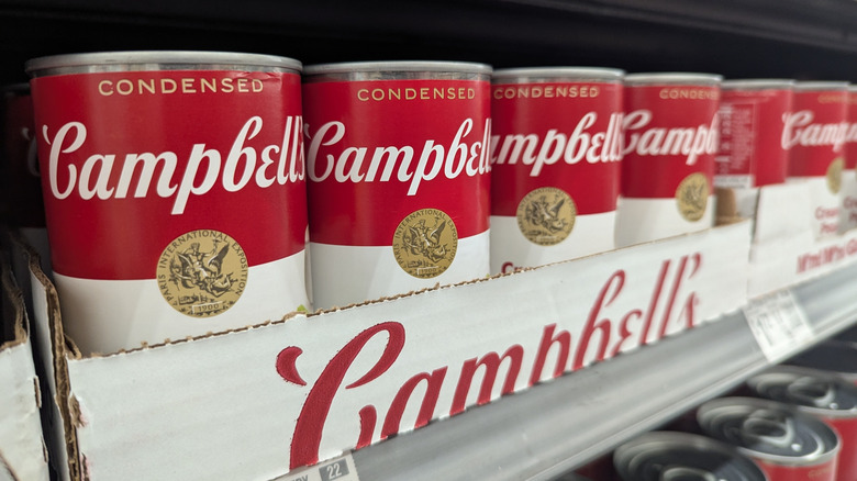 A row of cans of Campbell's soup.