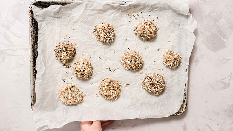 Raw coconut cookies on baking sheet