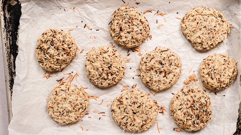 Baked coconut cookies on baking sheet