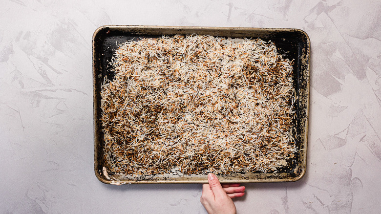 Toasted coconut cooling on baking sheet