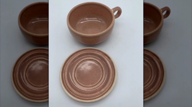 Mirrored image of Russel Wright mug with saucer