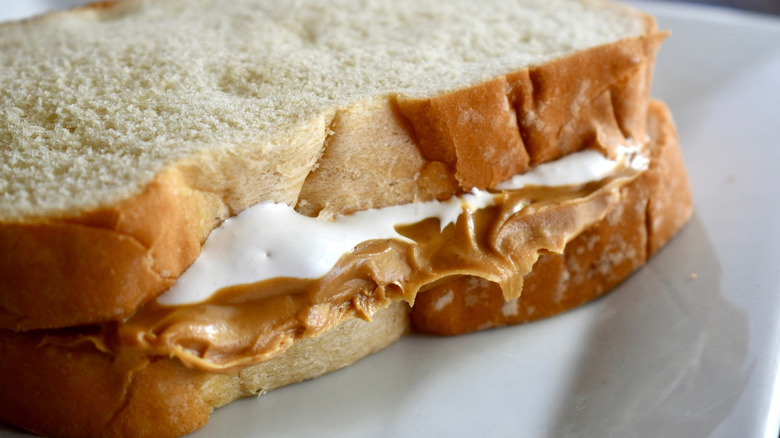 Close-up of a Fluffernutter sandwich on a white plate