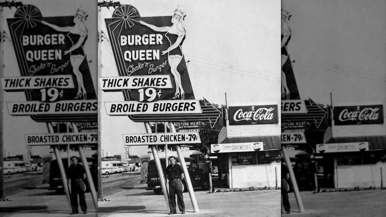 A black and white photo of a Burger Queen store front