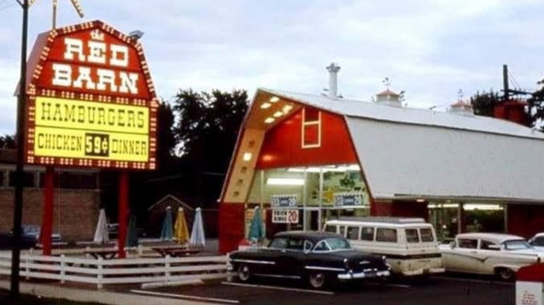 A Red Barn restaurant and sign on a cloudy day