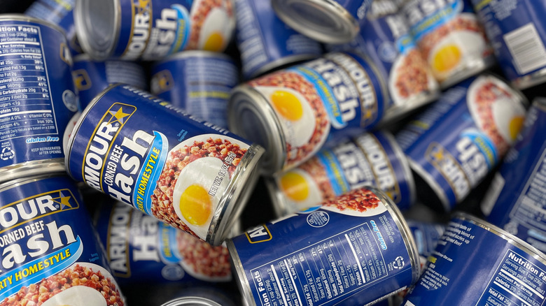 Grocery Store Armour corned beef hash in a can piled up in a display bin