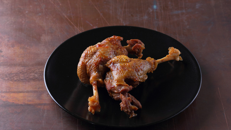 Mirrored image of deep-fried squirrel in a pan