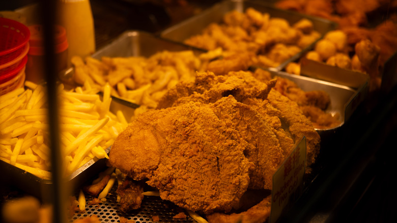 fried eggs with waffles served with spam and home fries