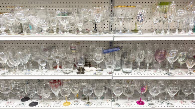 Glassware on shelves at thrift store