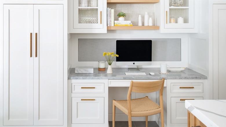 A bright custom desk nook seamlessly integrated into a kitchen area