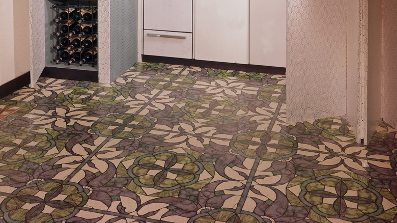 A pattern of linoleum flooring in a small model kitchen