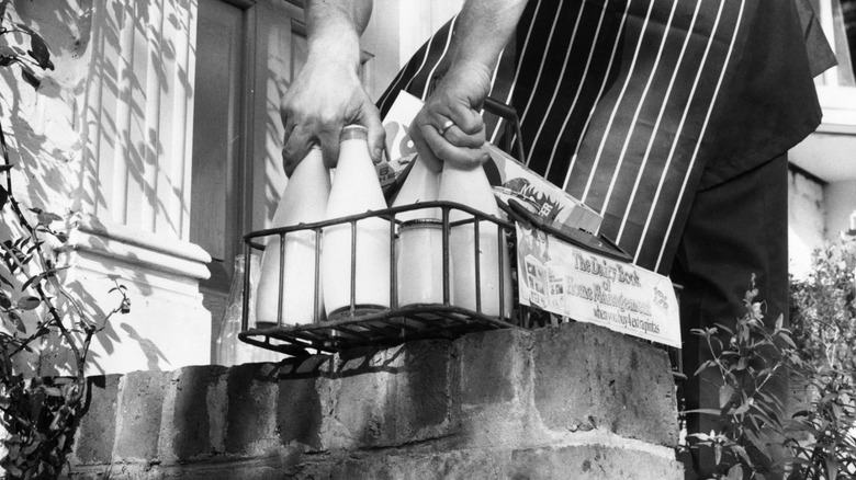 A milk man delivering a daily quota of milk