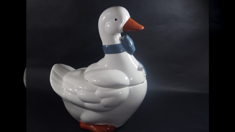 A vintage goose-shaped ceramic cookie jar.