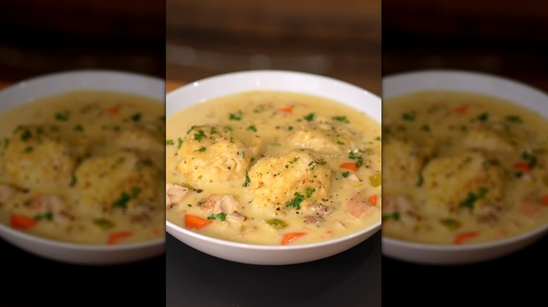 Bowl of chicken, veggie, and dumpling soup