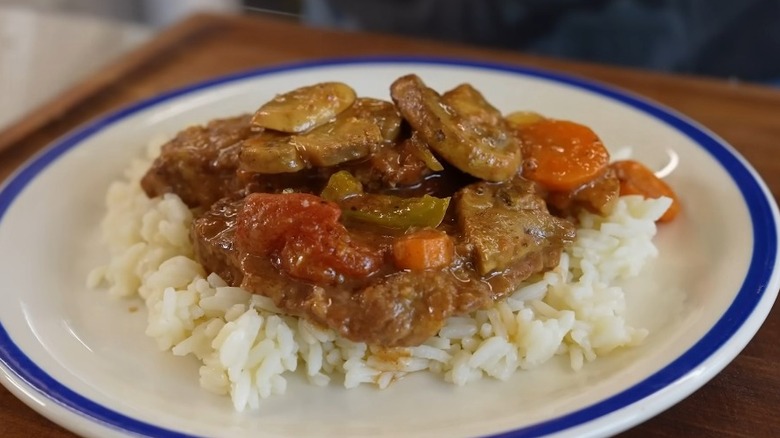 Plate of Swiss steak with rice
