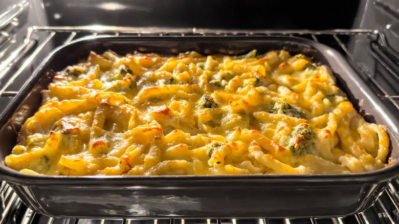 cheesy pasta casserole in oven